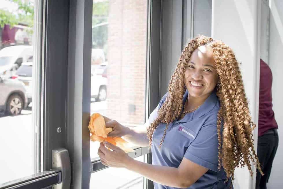 Diverse team of cleaning professionals working together